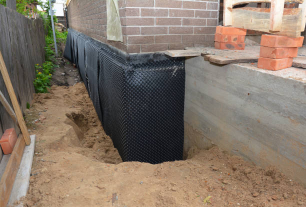 SJ Waterproofing Pros technician performing targeted Waterproofing assessment in Glenwood, MN